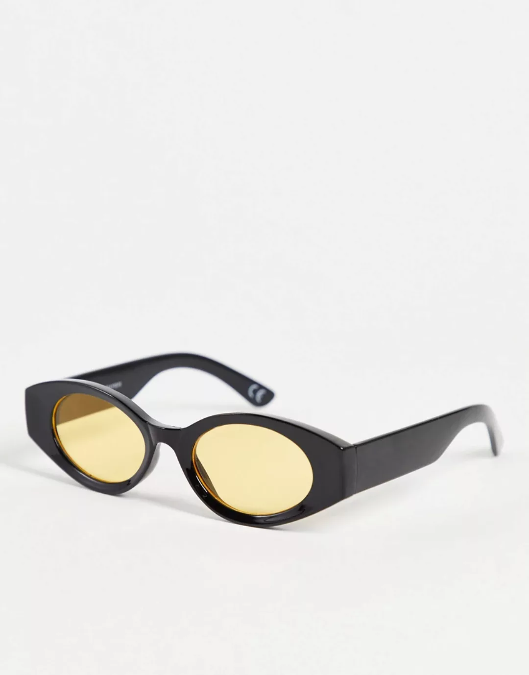 ASOS DESIGN – Ovale, mittelgroße Sonnenbrille in Schwarz mit gelben Gläsern günstig online kaufen