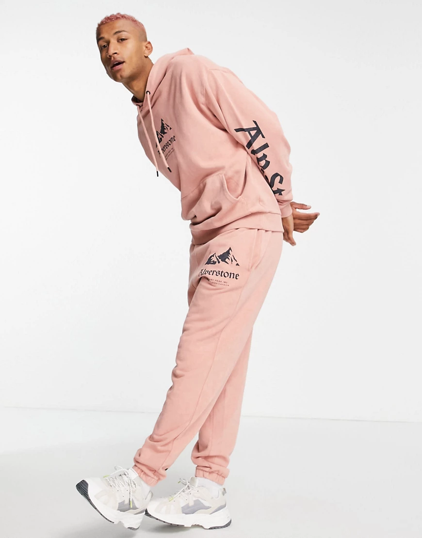 ASOS DESIGN – Oversize-Kapuzenpullover in rosa Waschung mit aufgedrucktem B günstig online kaufen