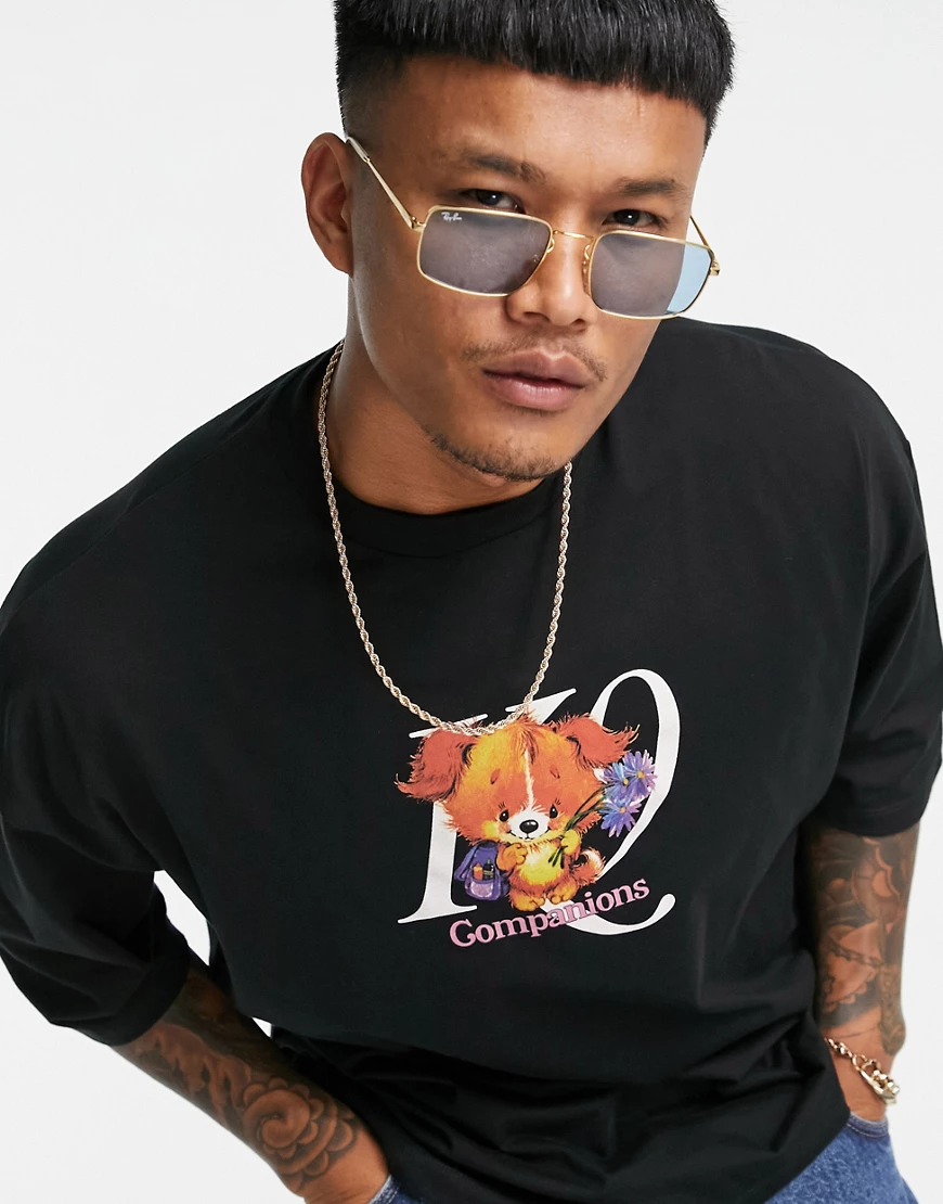 ASOS DESIGN – Oversize-T-Shirt in Schwarz aus Bio-Baumwolle mit Welpen-Prin günstig online kaufen