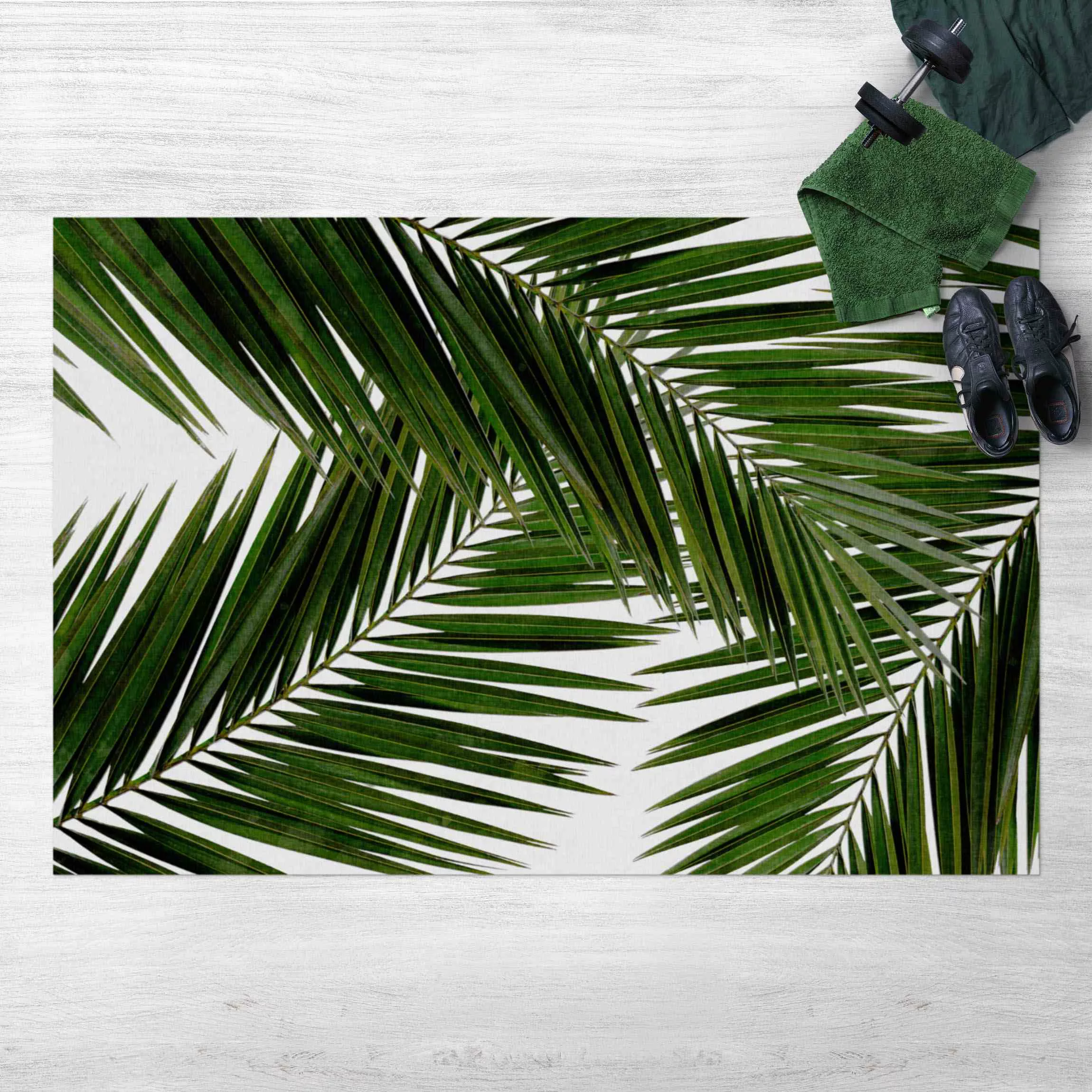 Vinyl-Teppich Blick durch grüne Palmenblätter günstig online kaufen