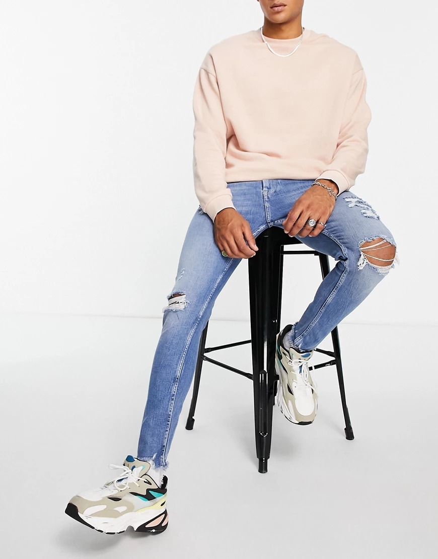 Bershka – Sehr enge Jeans mit Rissen, in Dunkelblau günstig online kaufen