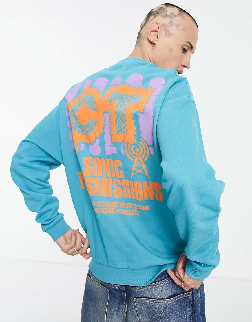 Crooked Tongues – Sweatshirt in Blau mit Grafikprint auf dem Rücken günstig online kaufen