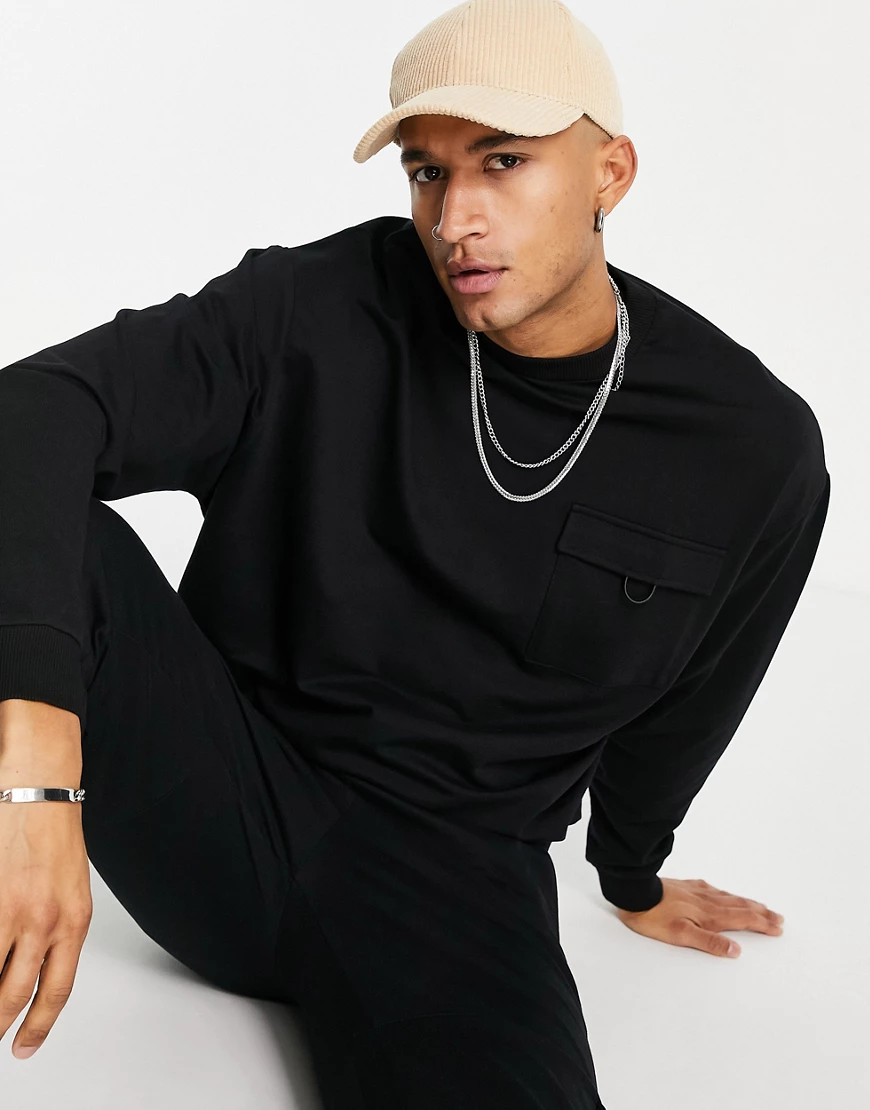 ASOS DESIGN – Oversize-Sweatshirt in in verwaschenem Schwarz mit Tasche, Ko günstig online kaufen