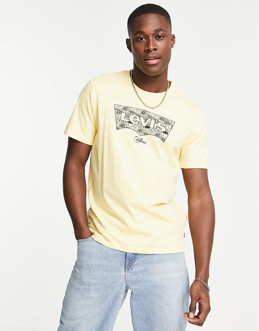 Levi's – Housemark – Gelbes T-Shirt mit Grafik günstig online kaufen