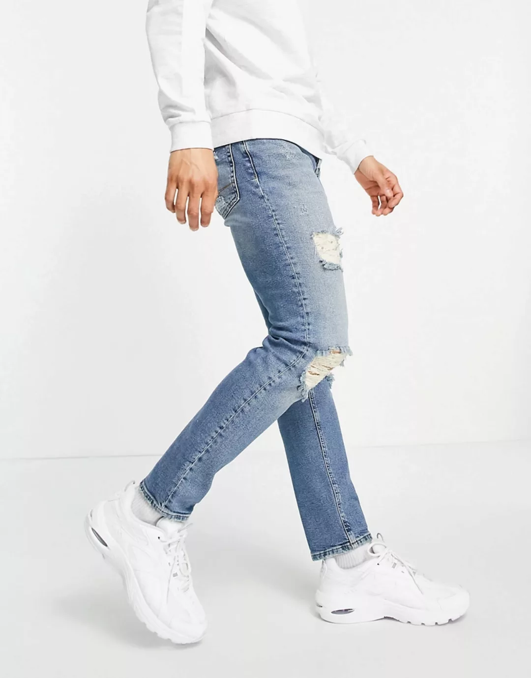 ASOS DESIGN – Schmale Stretch-Jeans mit großen Rissen in mittlerer Vintage- günstig online kaufen