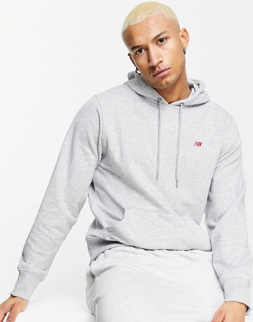 New Balance – Grauer Kapuzenpullover mit kleinem Logo günstig online kaufen