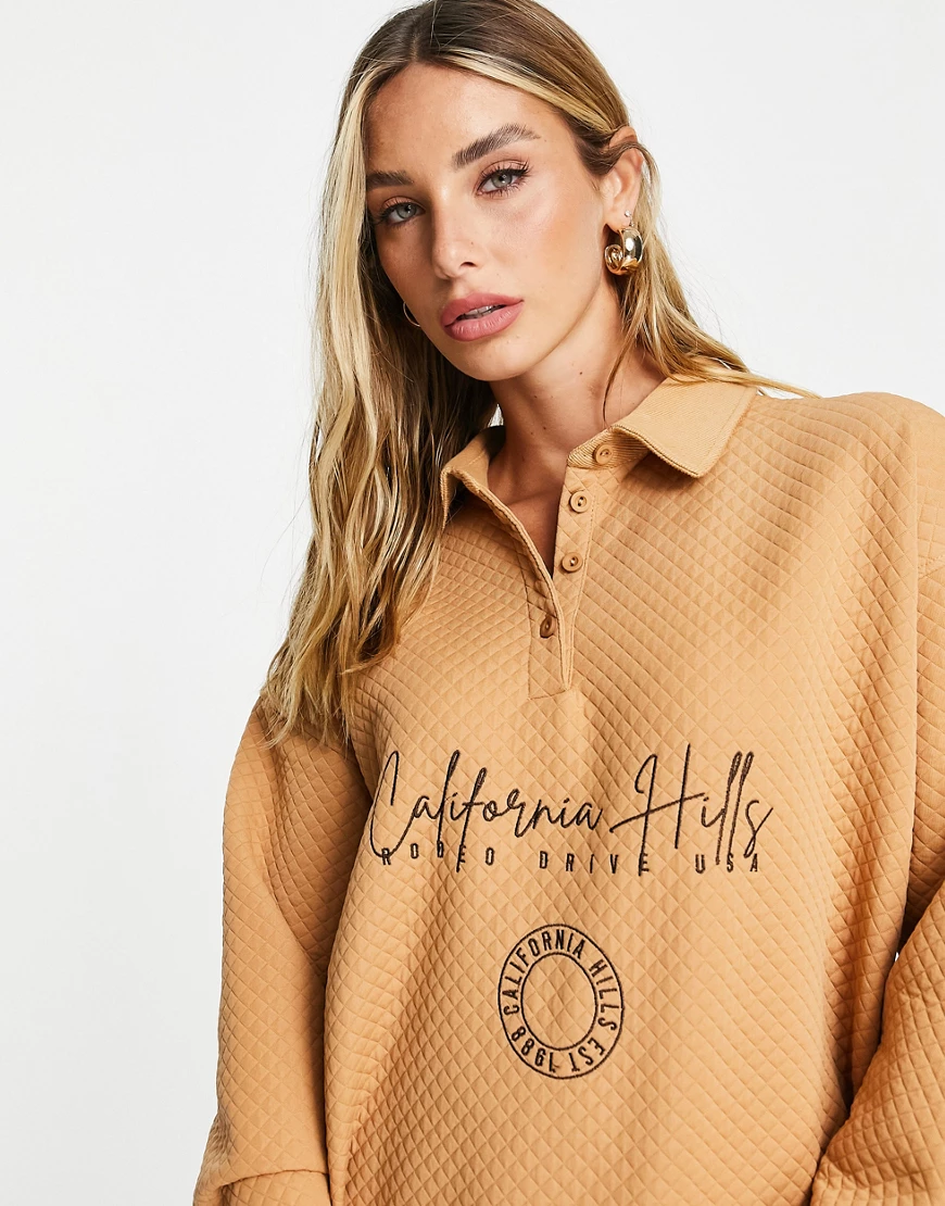 River Island – California – Besticktes Sweatshirt mit Polokragen und Steppm günstig online kaufen