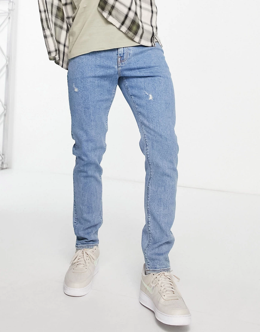 ASOS DESIGN – Eng geschnittene Jeans in heller „Less Thirsty“-Waschung mit günstig online kaufen