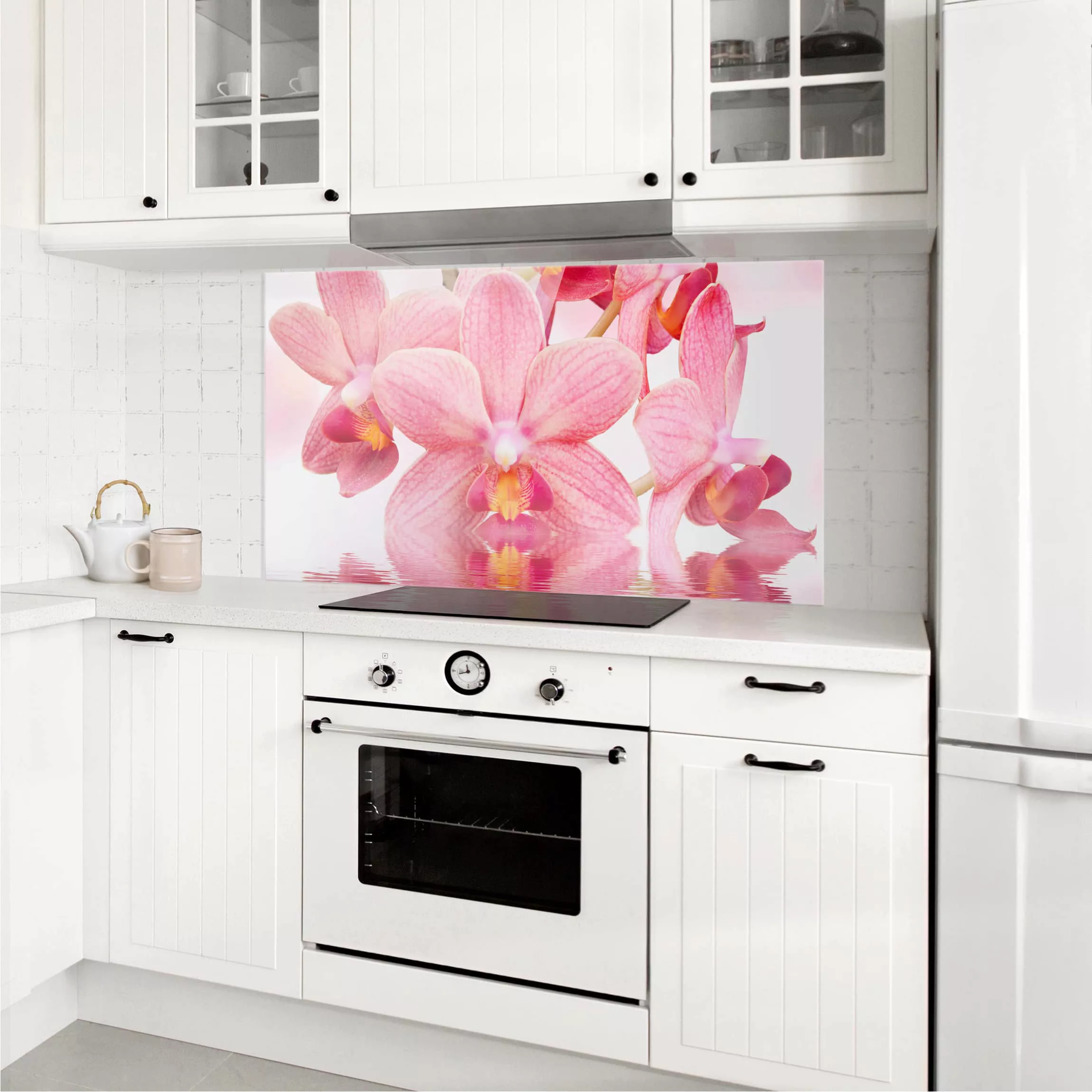 Glas Spritzschutz Blumen - Querformat 2:1 Rosa Orchideen auf Wasser günstig online kaufen