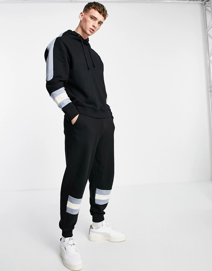 ASOS DESIGN – Oversize-Jogginghose mit Streifen im Farbblockdesign, Kombite günstig online kaufen