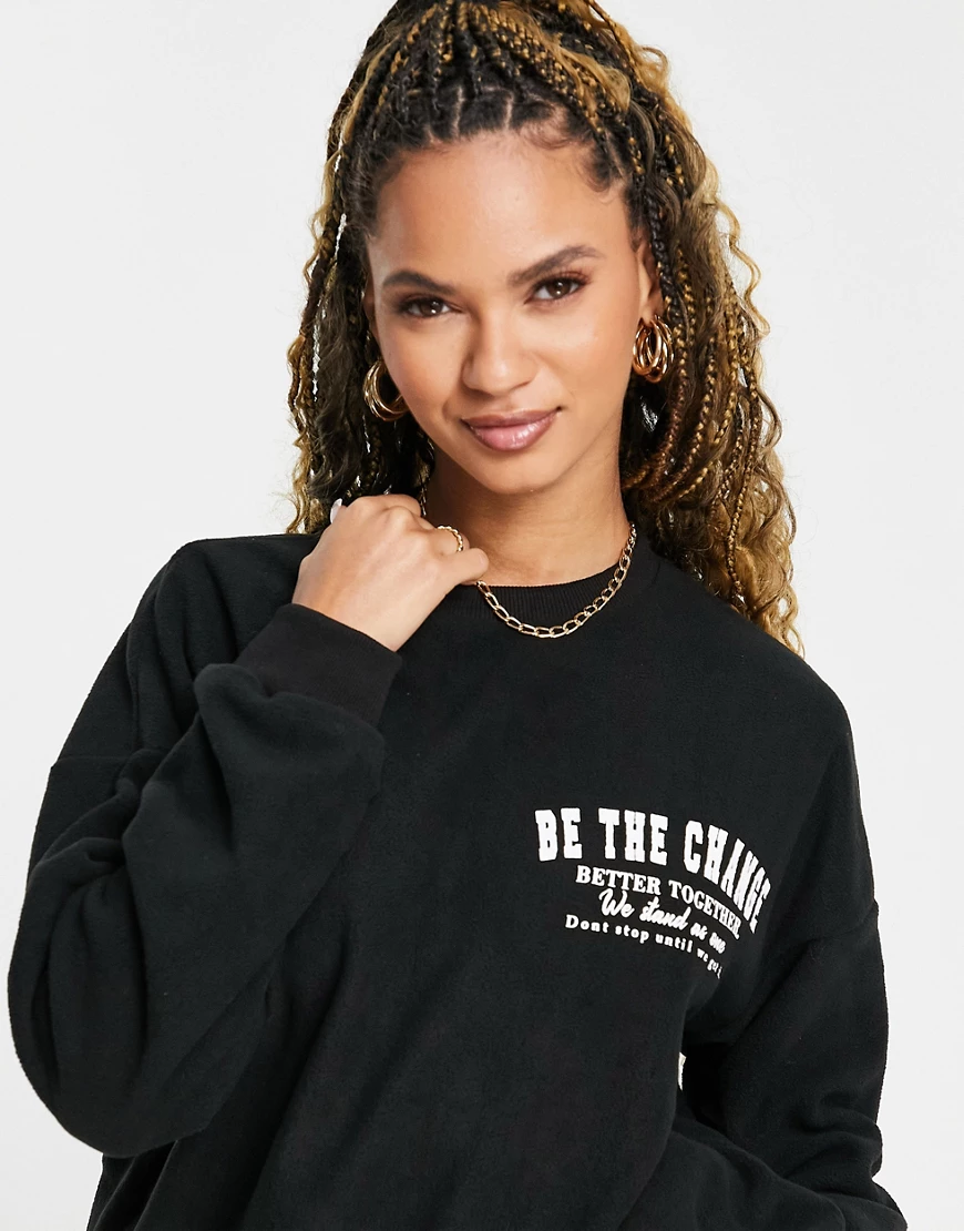 Missguided – Fleece-Sweatshirt mit „Be the Change“-Schriftzug in Schwarz günstig online kaufen