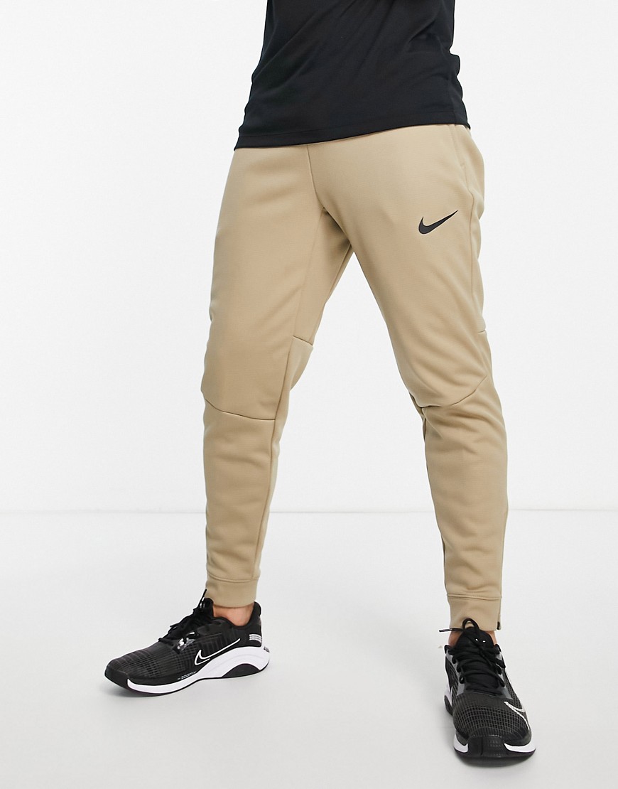 Nike – Pro Training Therma-FIT Sphere – Jogginghose in Steingrau-Neutral günstig online kaufen