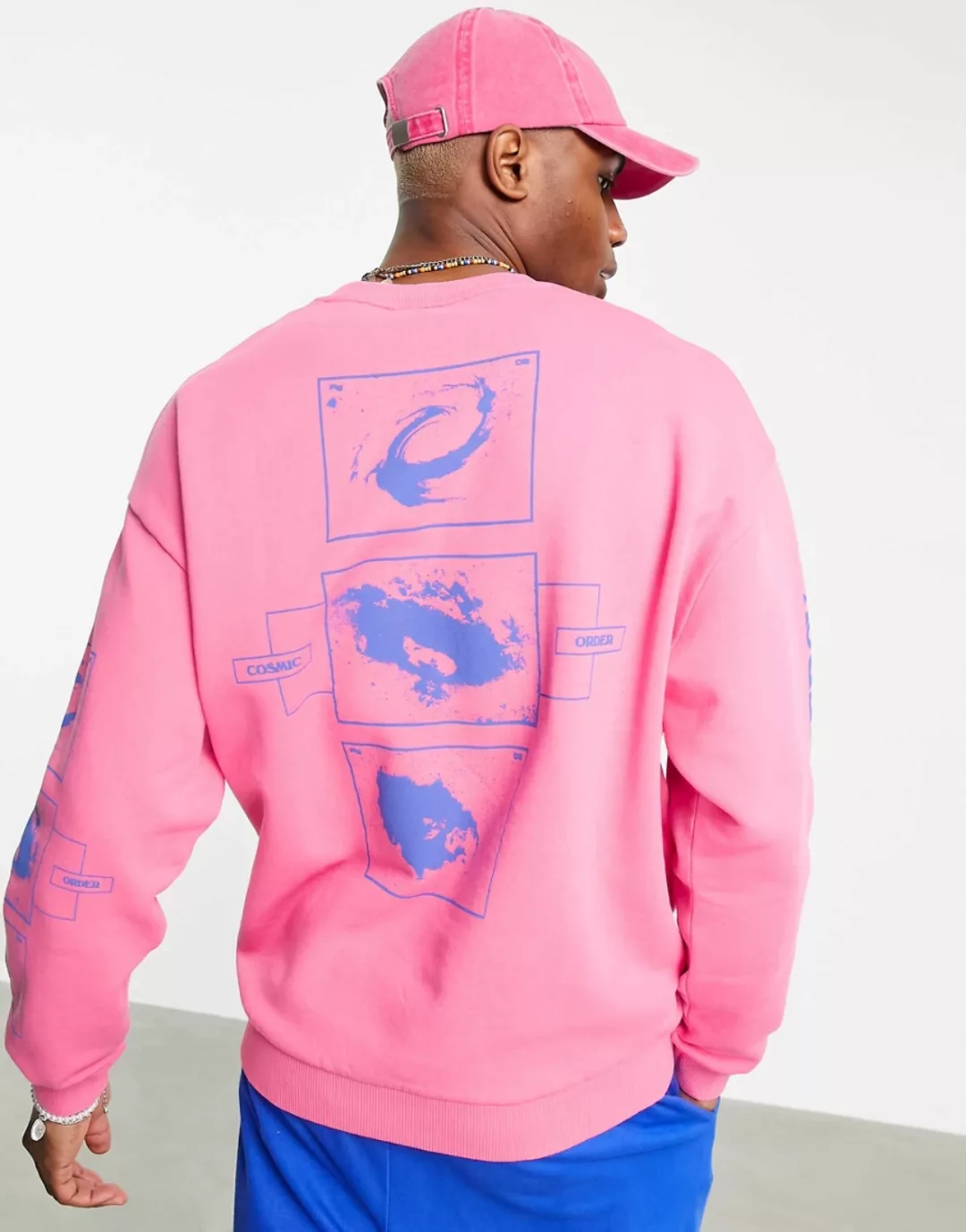 ASOS DESIGN – Oversize-Sweatshirt in verwaschenem Rosa mit mehrfarbigem Pla günstig online kaufen