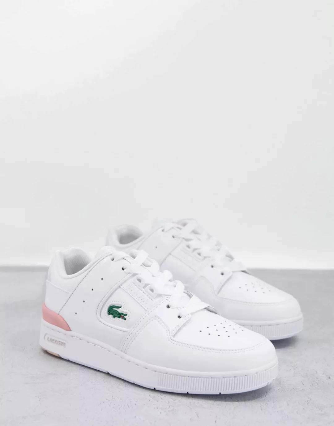 Lacoste – Court Cage – Ledersneaker in Weiß und Rosa günstig online kaufen