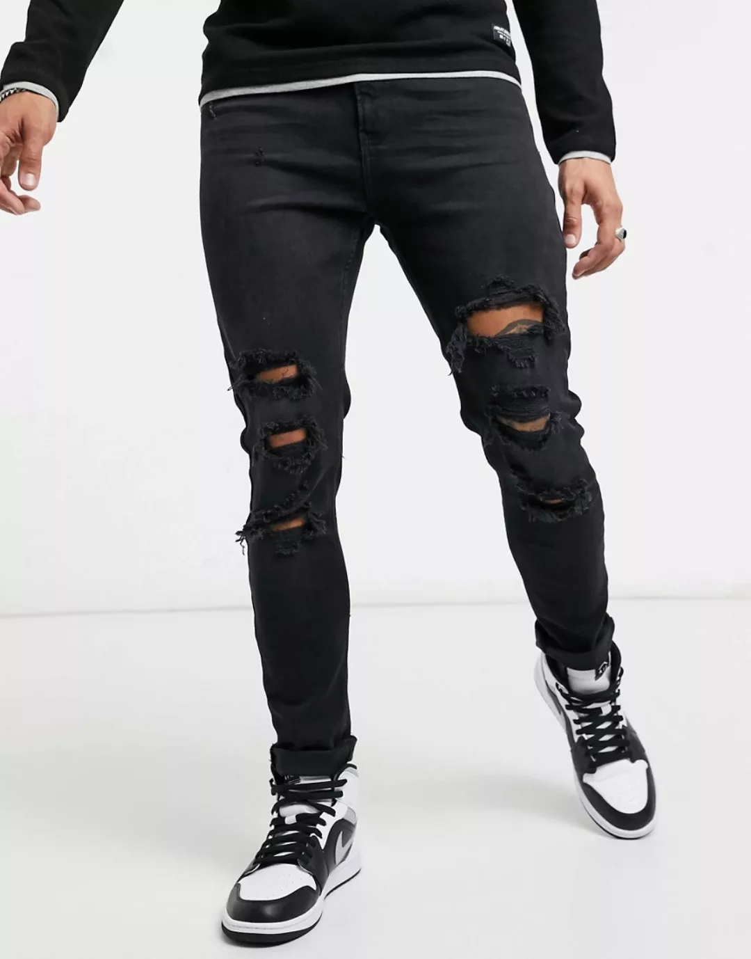 Bershka – Superenge Jeans in Schwarz mit Zierrissen günstig online kaufen