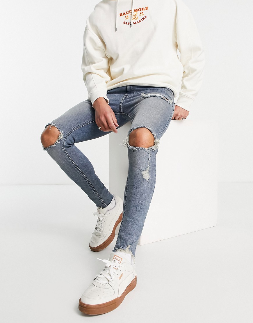 ASOS DESIGN – Hautenge Jeans aus Power-Stretch in getönter, mittlerer Wasch günstig online kaufen
