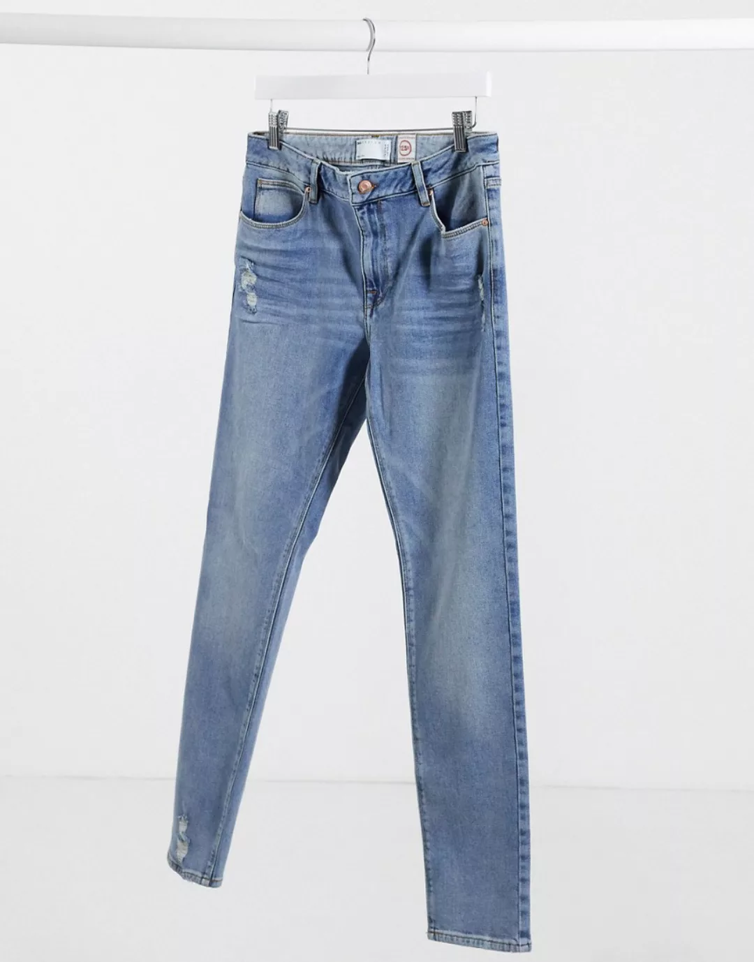 ASOS DESIGN – Skinny-Jeans in verwaschenem Mittelblau mit Abnutzungseffekte günstig online kaufen