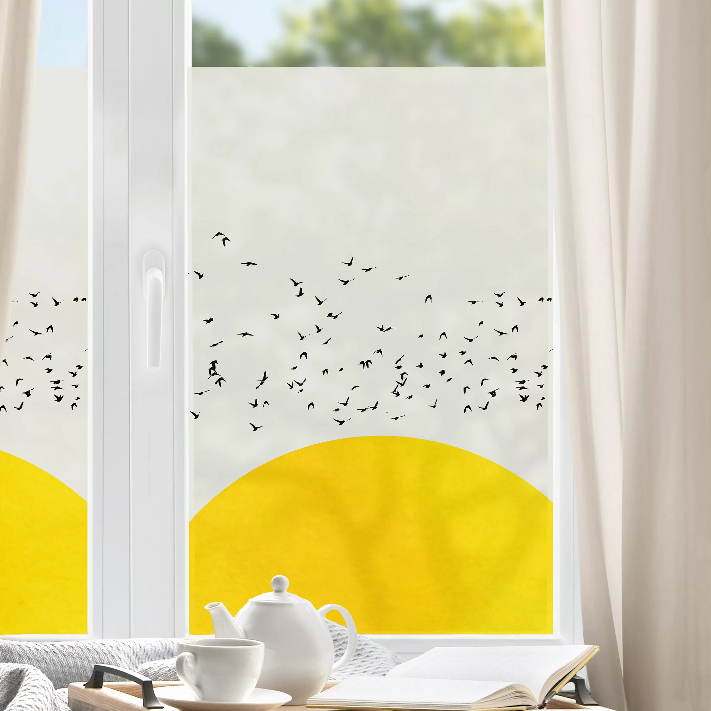 Fensterfolie Vogelschwarm vor gelber Sonne günstig online kaufen