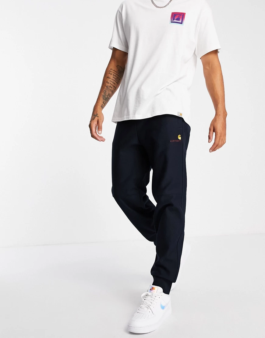 Carhartt WIP – American Script – Jogginghose in Marineblau-Co günstig online kaufen