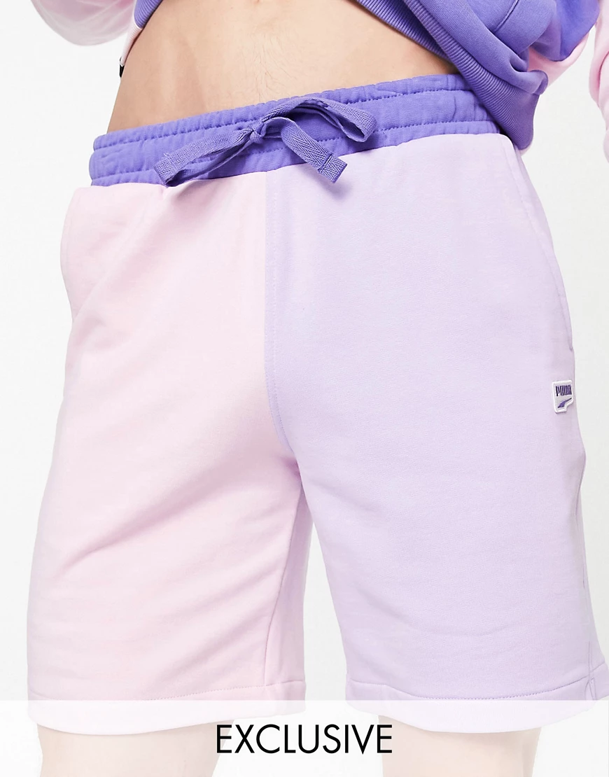 PUMA – Downtown – Asymmetrische Shorts in Rosa und Lila günstig online kaufen