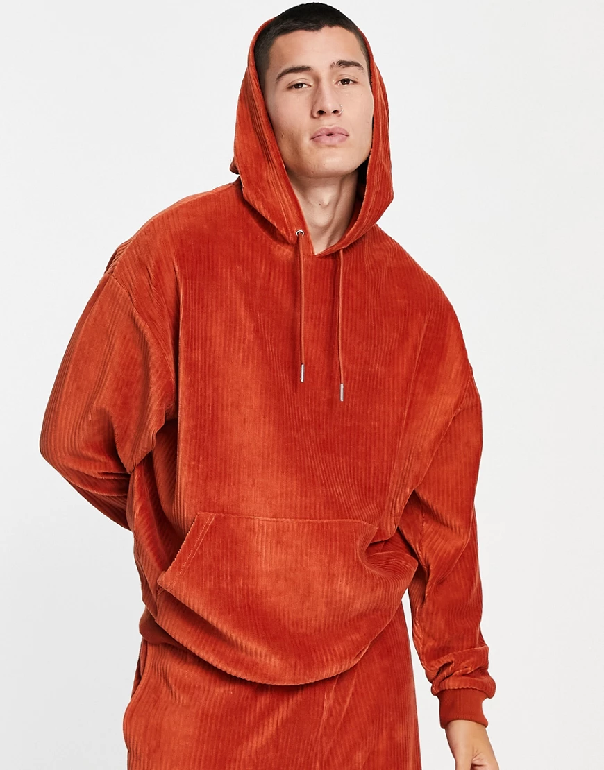 ASOS DESIGN – Oversize-Kapuzenpullover aus geripptem Velours in Tabakbraun, günstig online kaufen