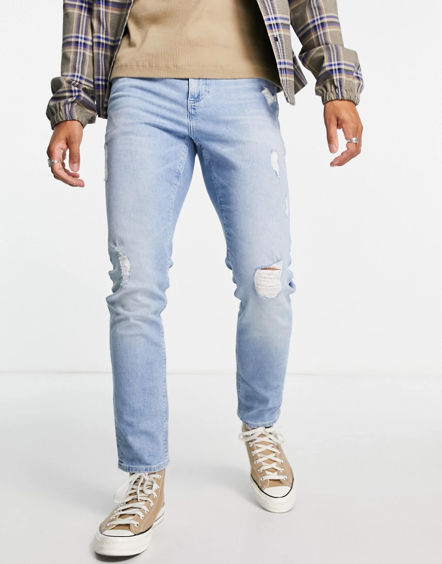 ASOS DESIGN – Jeans mit schmalem Schnitt, Stretchanteil und Abnutzungen in günstig online kaufen