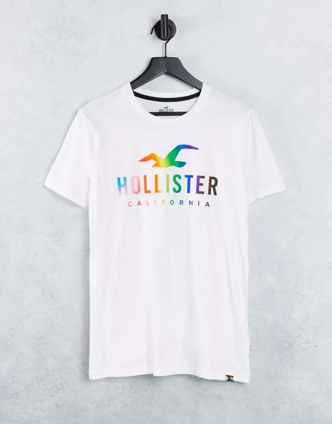 Hollister – Pride Capsule – T-Shirt in Weiß mit Regenbogen-Logo günstig online kaufen