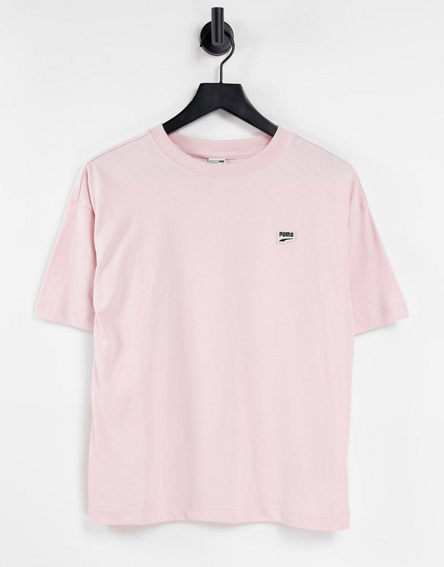 Puma – Downtown – Oversize-T-Shirt in Pastellrosa mit Logo günstig online kaufen