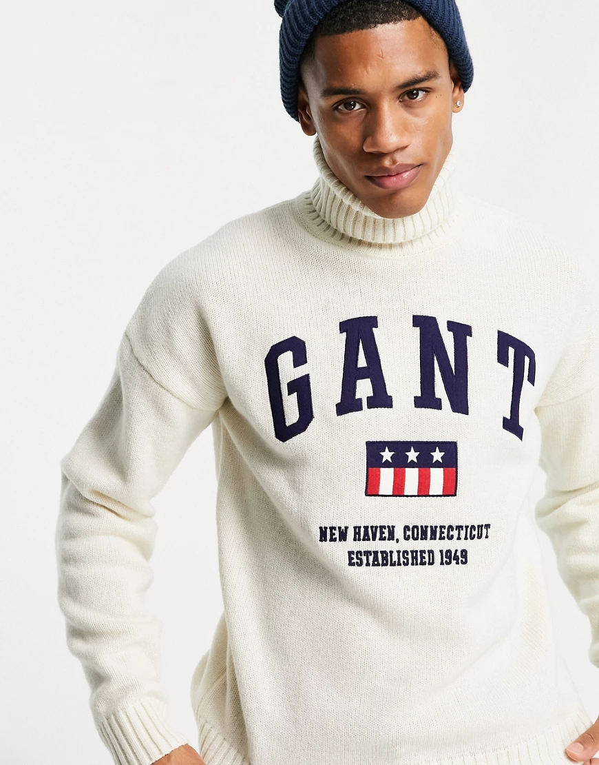 GANT – Strickpullover aus Wolle in Cremeweiß mit Rollkragen und Schild-Logo günstig online kaufen