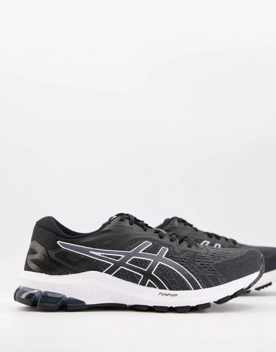 Asics – GT-1000 10 – Lauf-Sneaker in Schwarz und Weiß günstig online kaufen