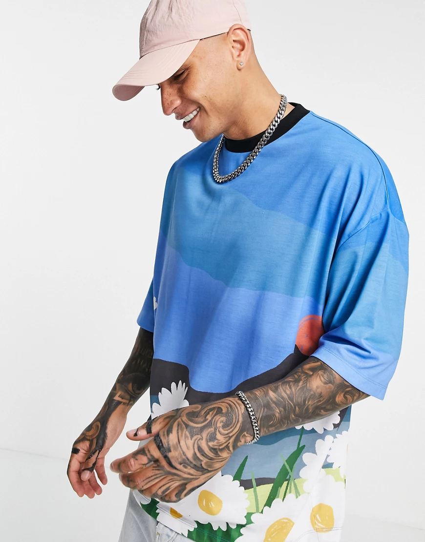 ASOS DESIGN – Durchgehend bedrucktes Oversize-T-Shirt in Blau günstig online kaufen