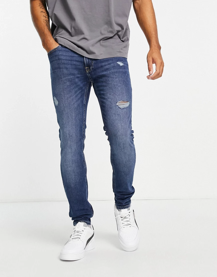 Jack & Jones Intelligence – Liam – Eng geschnittene Jeans in Blau mit Abnut günstig online kaufen